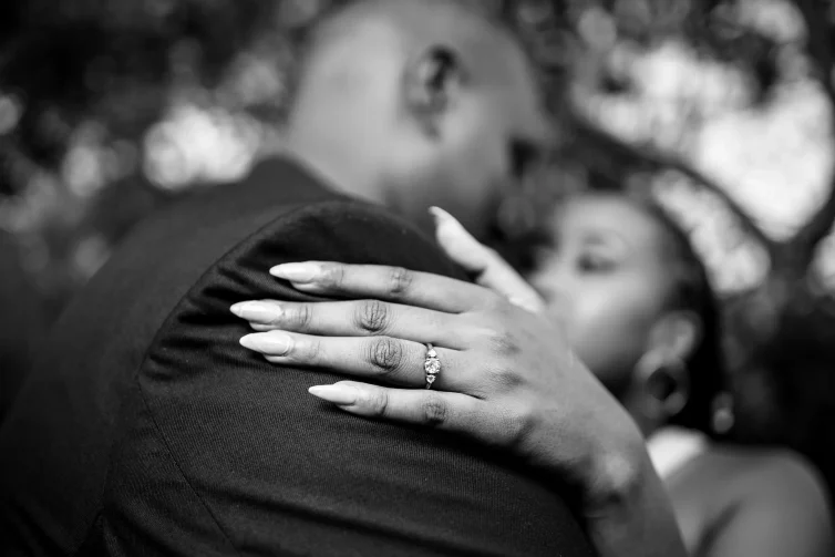 Romantic couple embracing at Nairobi Safari Walk, capturing love and adventure in Kenya.