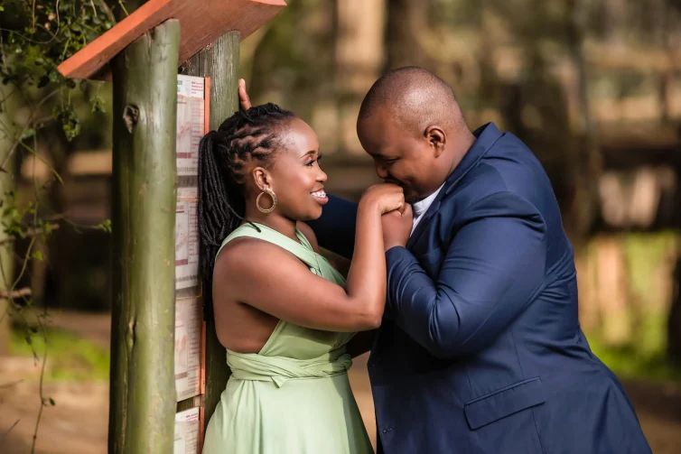 Wedding couple sharing a romantic moment outdoors in Kenya.